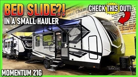 A Full Bed Slide in a Grand Design Toy Hauler RV.