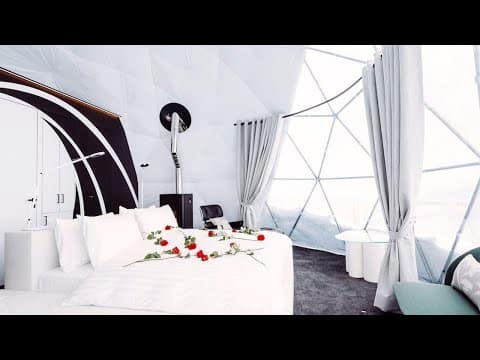 An interior world with a bed and a bedside table.