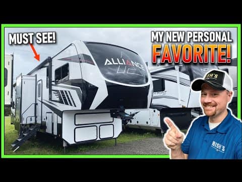 A man is pointing at the Ultimate Rig, a new 2022 Alliance Valor 40V13 RV.