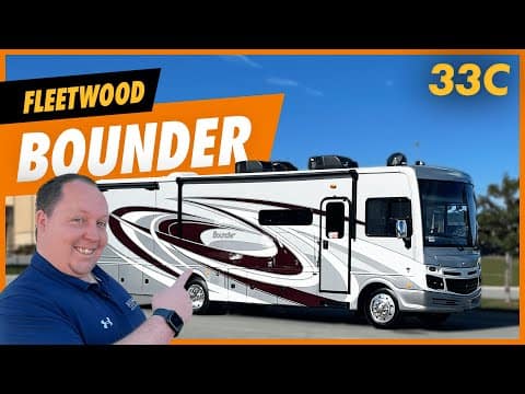 A man is standing in front of his **2023 Fleetwood Bounder 33C** RV, his new **home** on wheels.
