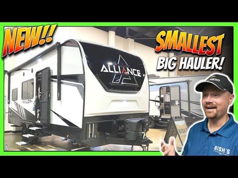 A man is standing in front of a new adventure-ready Alliance RV Valor Toy Hauler.
