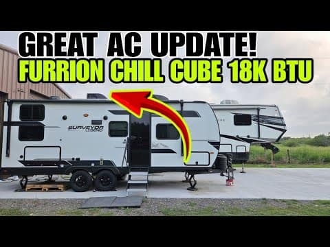 A travel trailer is parked outside a building with text above it that says "Great AC Update! Furrion Chill Cube 18K BTU with Auto Draft" and an arrow pointing to the trailer's rooftop AC unit.