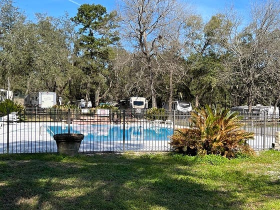 Spacious Skies Campgrounds, an rv park with a pool and trees, offering 15 locations.
