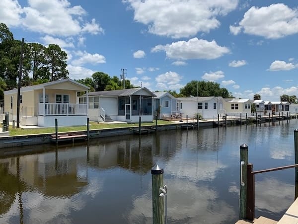 A row of mobile homes on the water in Winter Haven, Southwest Florida.