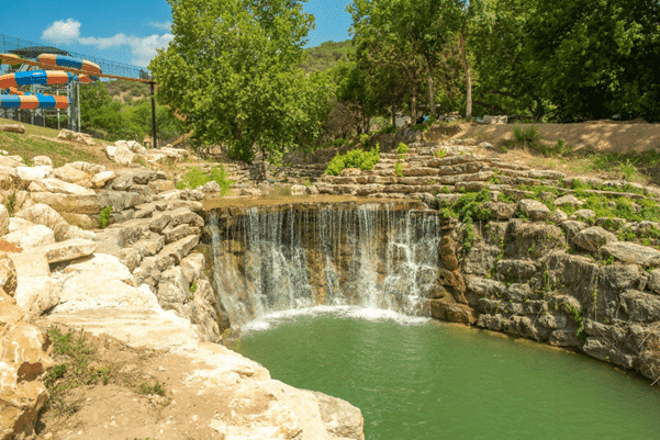 In its first year of operation, Camp Fimfo in the middle of a park is proud to offer new amenities including a picturesque waterfall.