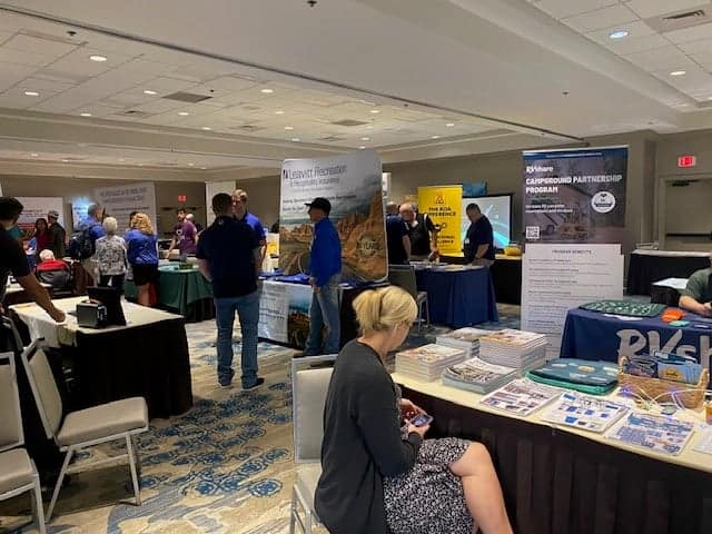 A group of people at a conference booth.