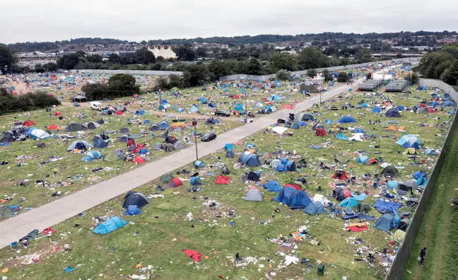 An aerial view of an abandoned area of UK festival tents.