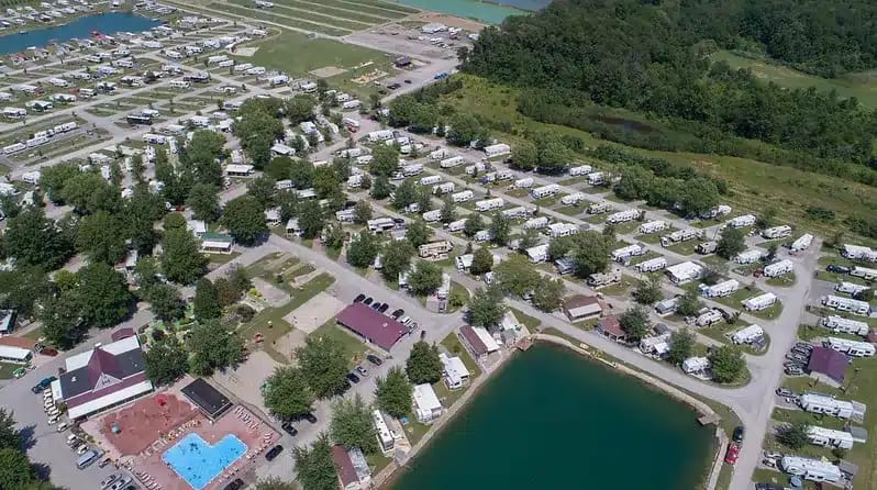 An aerial view of Huggy Bear Campground, a campground near a lake.