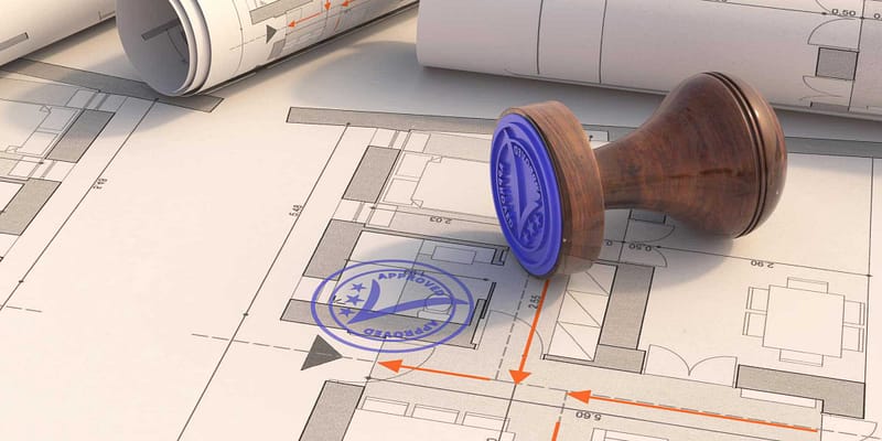 A blueprint with a blue stamp on top of it, indicating conditional approval for an RV park in Minnesota.