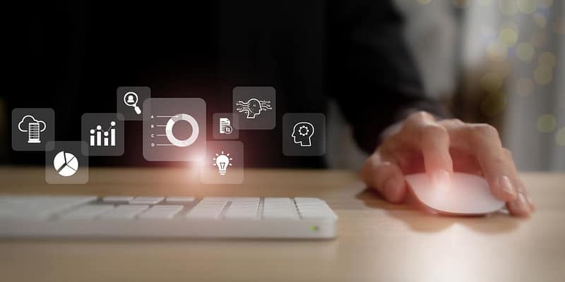 A person is typing on a keyboard with icons on it, performing benchmarking.