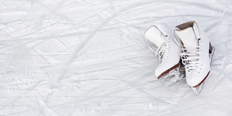 A pair of white ice skates gliding gracefully along the Arrowhead Provincial Park Ice Skating Trail during the 2024 season.