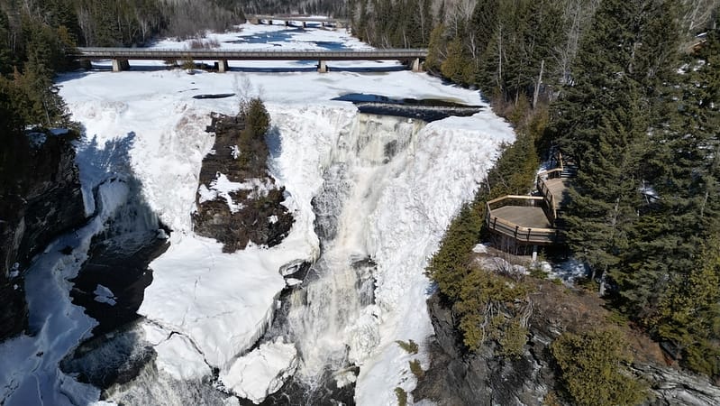 An aerial view of a winter waterfall in Ontario.