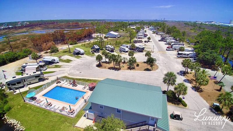 An aerial view of a camping resort with a swimming pool in Alabama, perfect for Snowbirds.