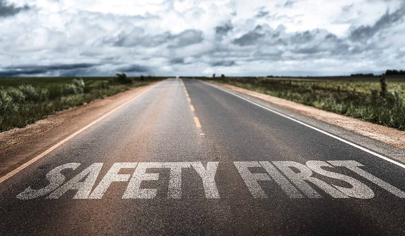 A road with the words "safety first" written on it, promoting Caravanning Road Safety Education.