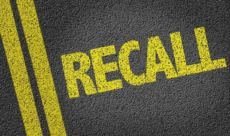 A road with the word recall written on it indicating vehicle recalls and safety concerns for RV manufacturers.