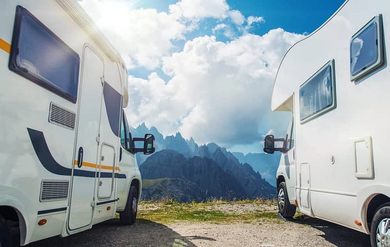 Two remote video assessments of two caravan buyers parked next to each other in the mountains.