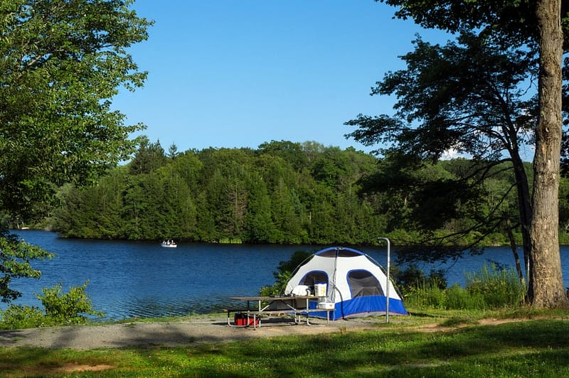 A picturesque blue sky with fluffy white clouds sets the perfect backdrop for camping adventures in Pennsylvania state parks.