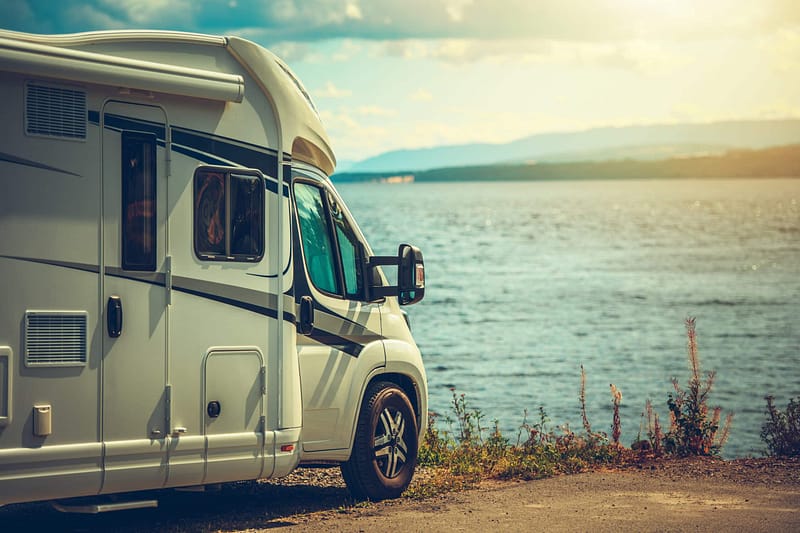 A proposed community development plan includes a white RV parked next to a body of water in Seeley Lake.