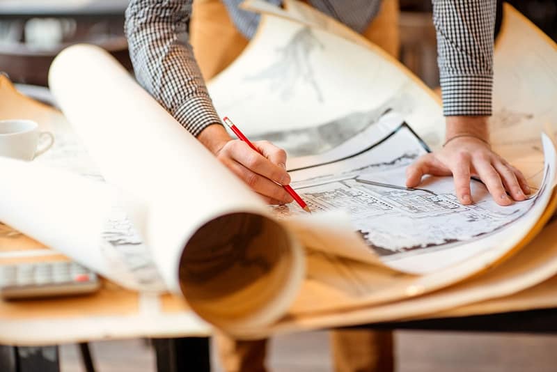 A person is drawing on a piece of paper.