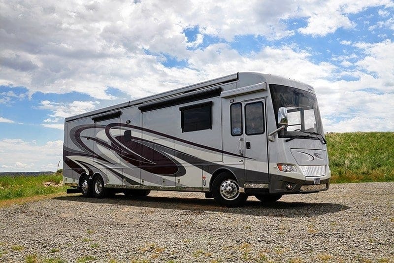An RV parked on a gravel road at the Florida RV Show.