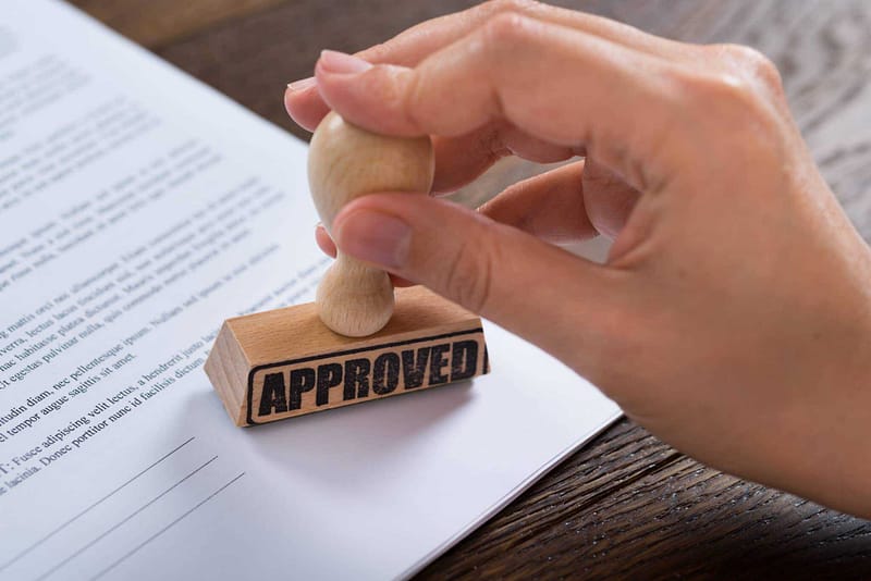 A rubber stamp with the word "approved" on it, perfect for the Grass Valley City Council's RV Park Proposal.