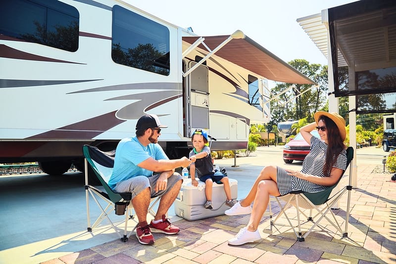 A family sits in chairs in front of an RV in the Milton Area of Florida.
Keywords: RV Parks, Florida, Milton Area