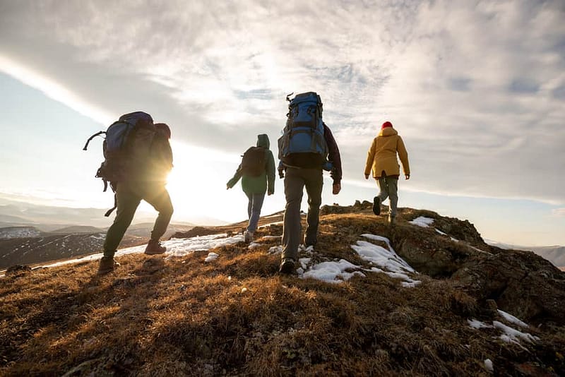 Group of hikers enjoying scenic views on top of a mountain in Victoria.