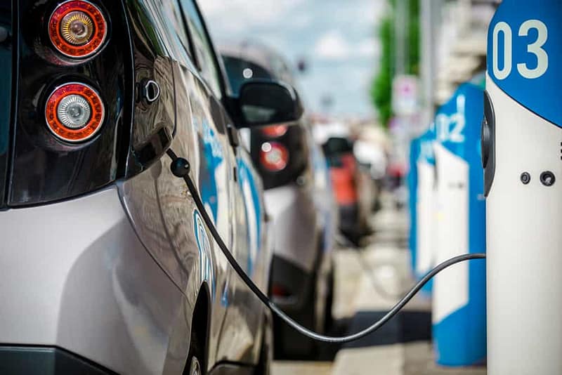 An electric car is plugged into an EV Charging Network.