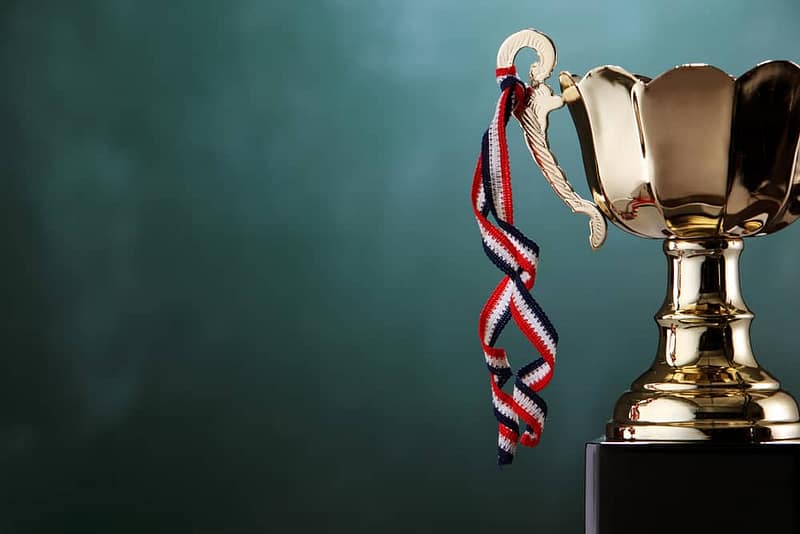 A gold trophy, representing an award nominations criteria, sits on top of a black background at the CCRCV.