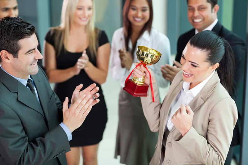 A group of business people clapping in celebration of the RVWA Awards.