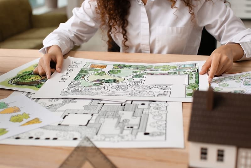 A woman is working on a plan for a garden in Wycheproof.