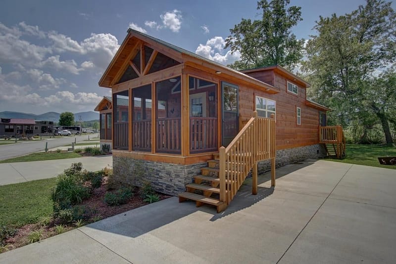 A small cabin in the woods near the Green River with a screened in porch.