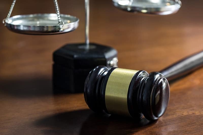 A judge's gavel and scales on a Peace River Regional District.
