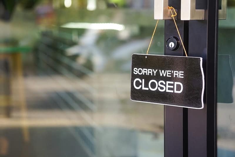 Sorry, we're closed sign hanging on a door of a Canadian tourism business.
