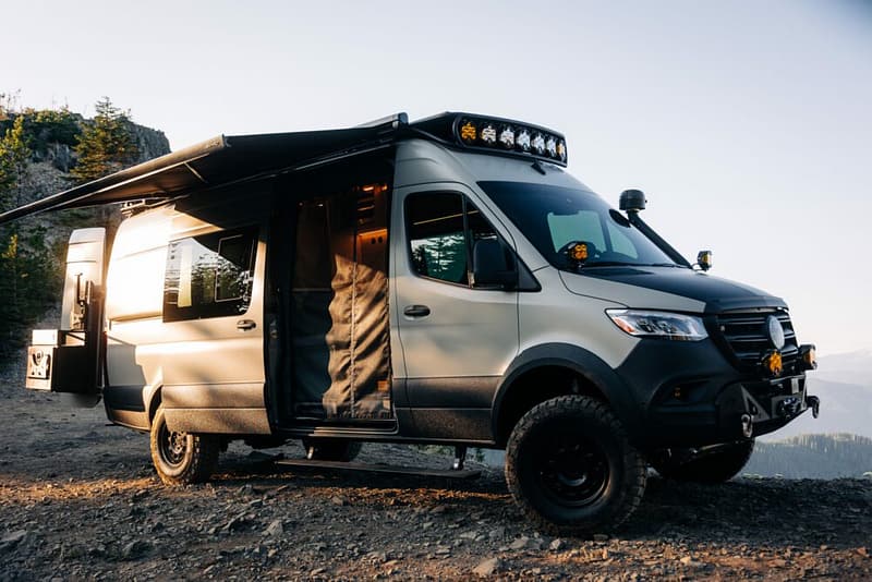 Embarking on unparalleled adventures, the Mercedes Sprinter RV is parked on a mountain.