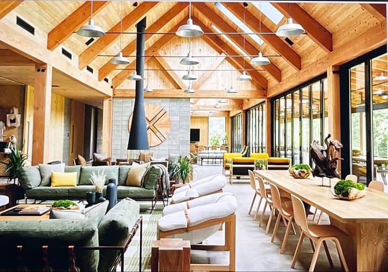 AutoCamp's Catskills Location offers a living room with wooden ceilings and wooden furniture at their second East Coast campground.