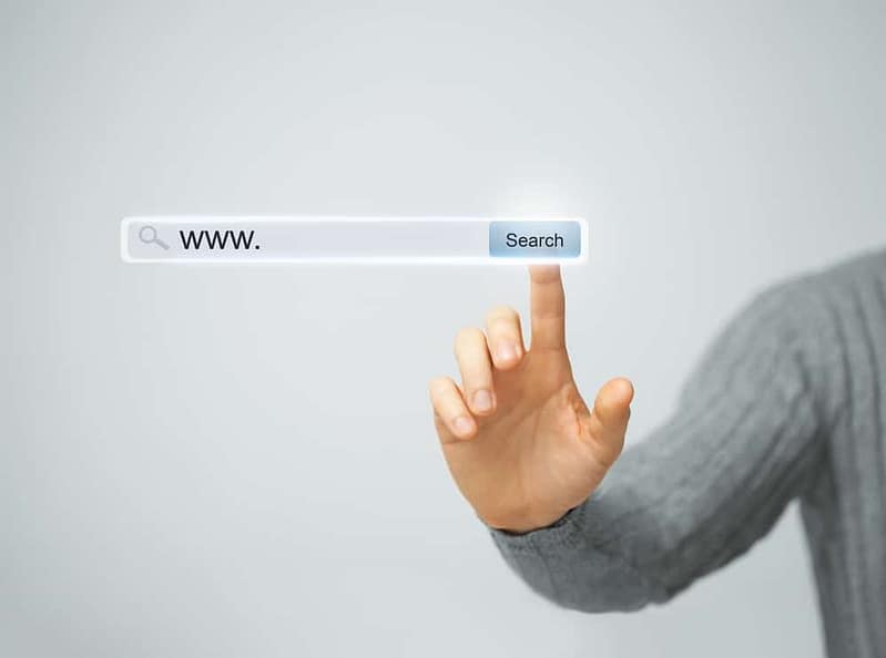 CRR Hospitality man's hand is pointing at a search button on their New Website.
