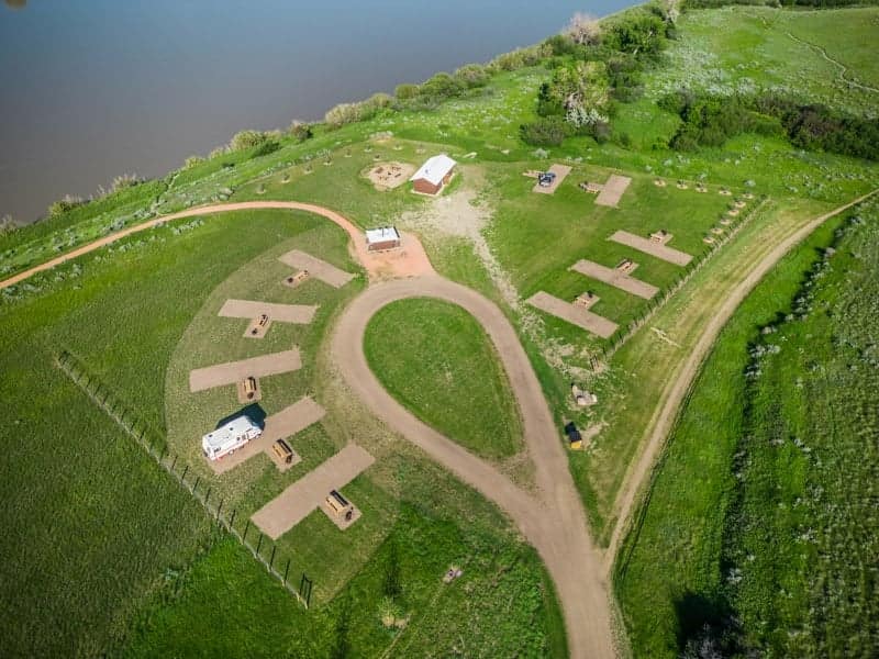 A campground near a river in Medicine Hat, available for reservations.