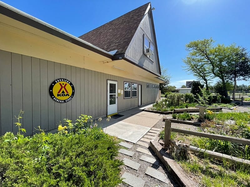 A building with a yellow sign in front of it in Goodland, Western Kansas.