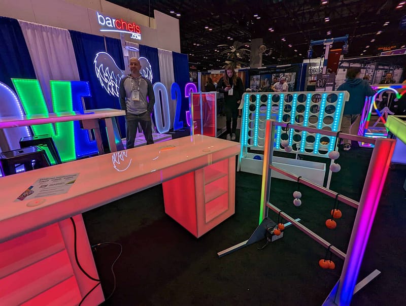 A neon-lit table at the IAAPA Expo.