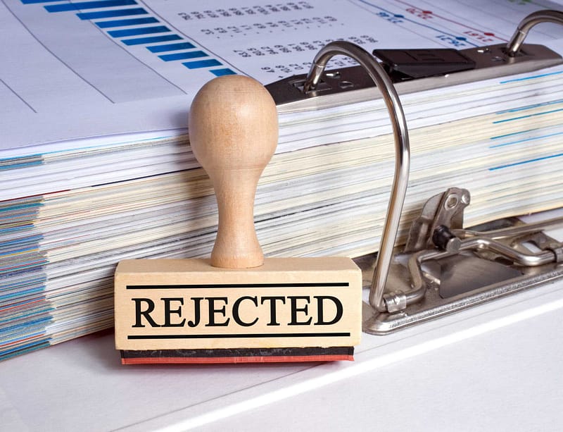 A rubber stamp with the word rejected on it, symbolizing the decision made by Hinsdale Officials to decline the RV Park Proposal in their small town.