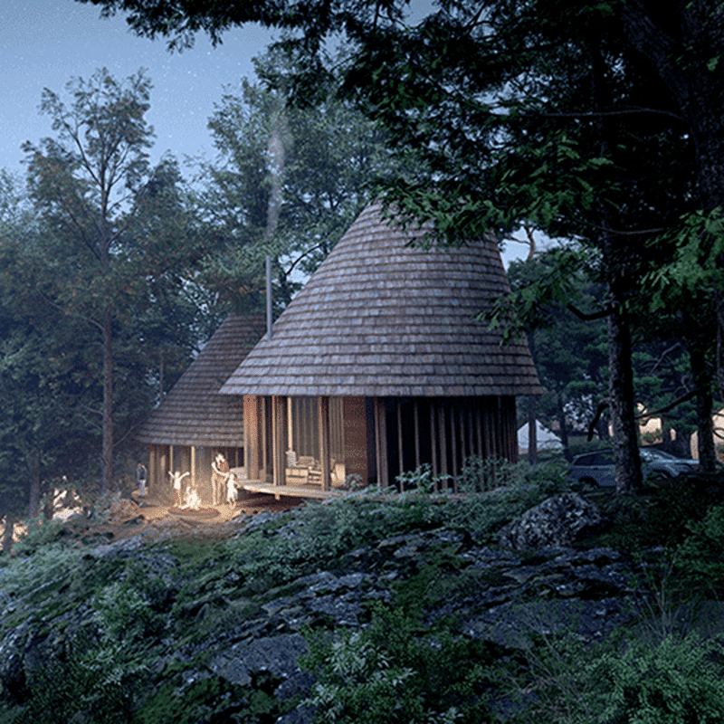 A wooden cabin sits on top of a hill in the woods.