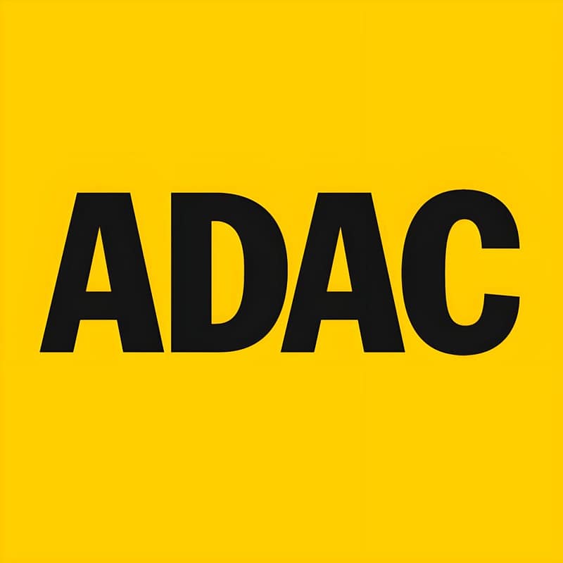 The ADAC logo, showcasing excellence and innovation, stands out on a vibrant yellow background.