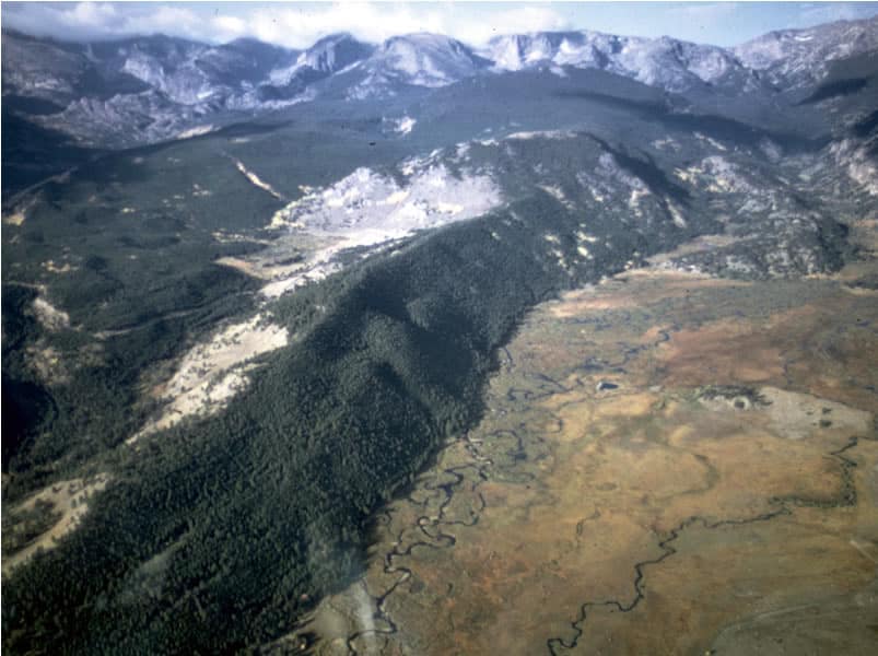 An aerial view of Moraine Park Campground nestled amidst the stunning mountains of Rocky Mountain National Park.