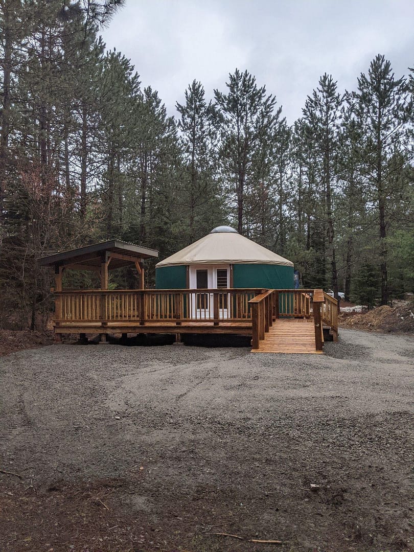 An Algonquin Park yurt nestled in a wooded area.
