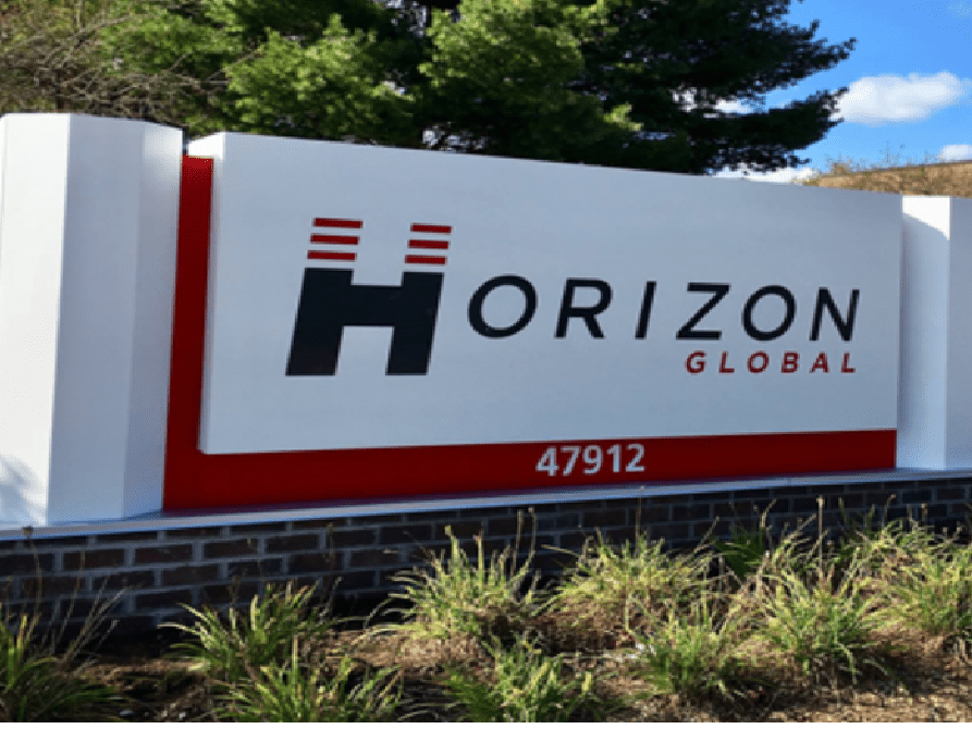 Continental's Horizon Global sign in front of a building.