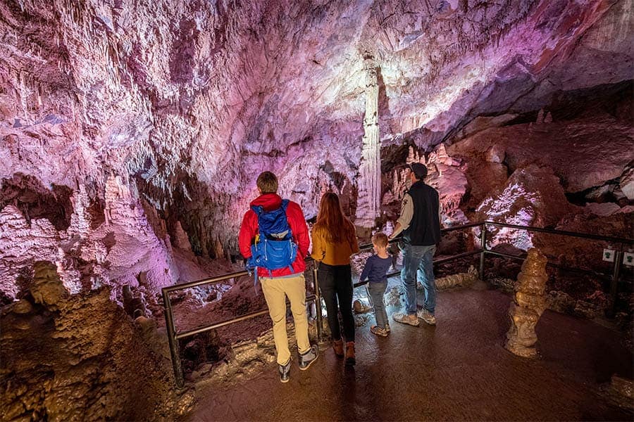 A group of people participating in summer events, standing inside Lewis and Clark Caverns State Park.