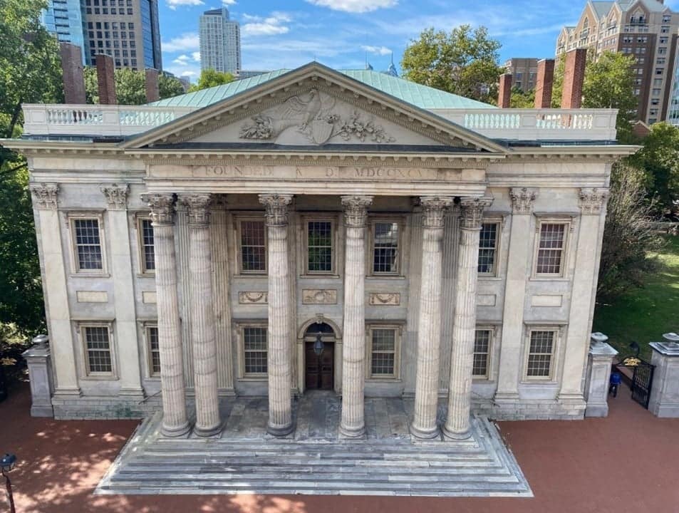 An aerial view of the First Bank of the United States building with majestic columns.