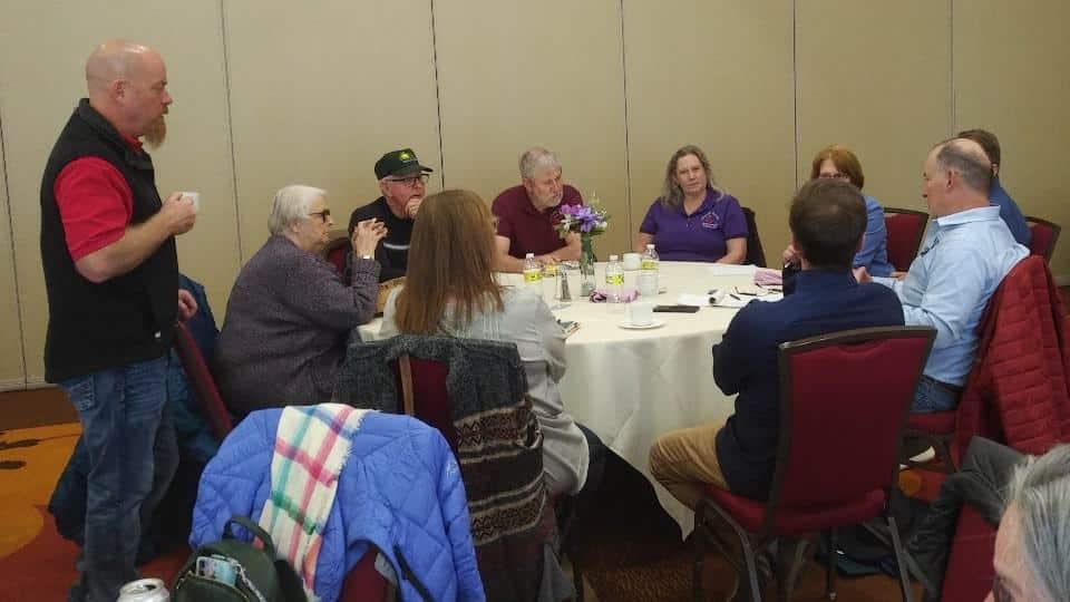A group of Campground Owners sitting around a table during the New York Spring Zone Meetings.