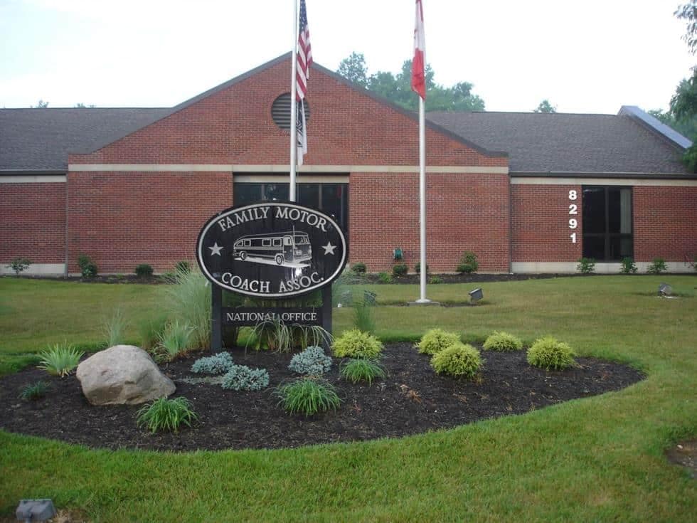 A brick building with a sign in front of it, located in Gillette.
